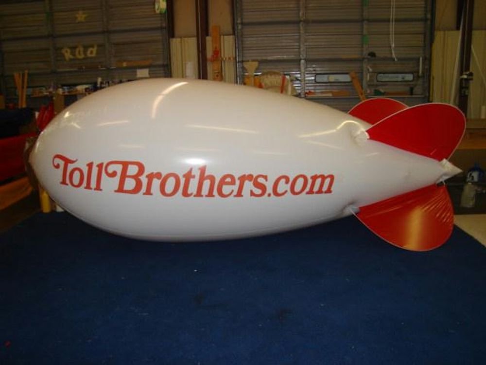 Custom logo advertising blimp printed for a national home builder